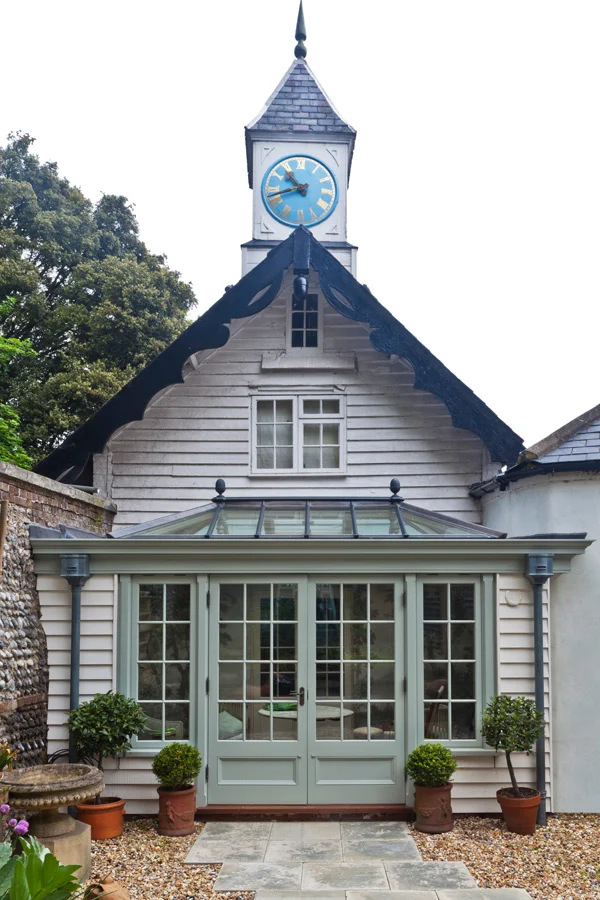 Outside of small conservatory which features work by alasdair Peebles inside