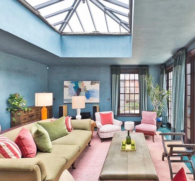 blue living room with roof light