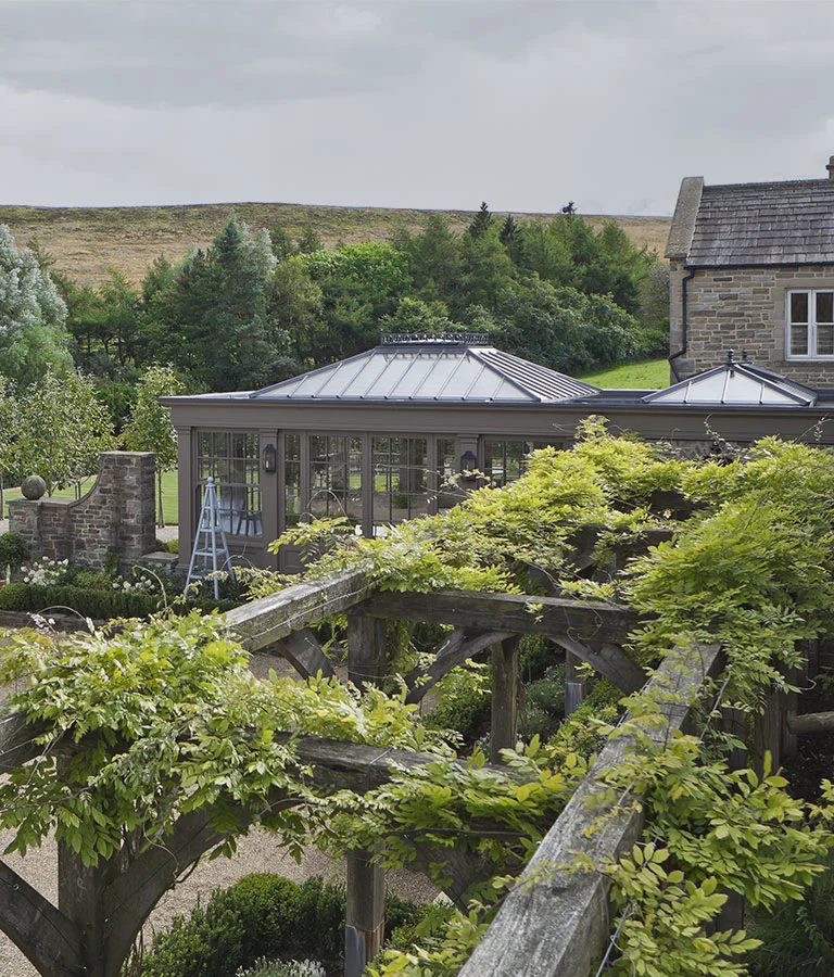 Green canopy leading to the orangery