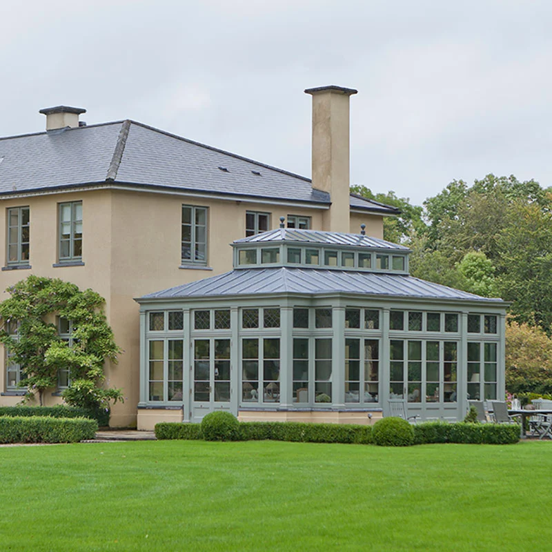 conservatory project with a lead roof and glass lantern