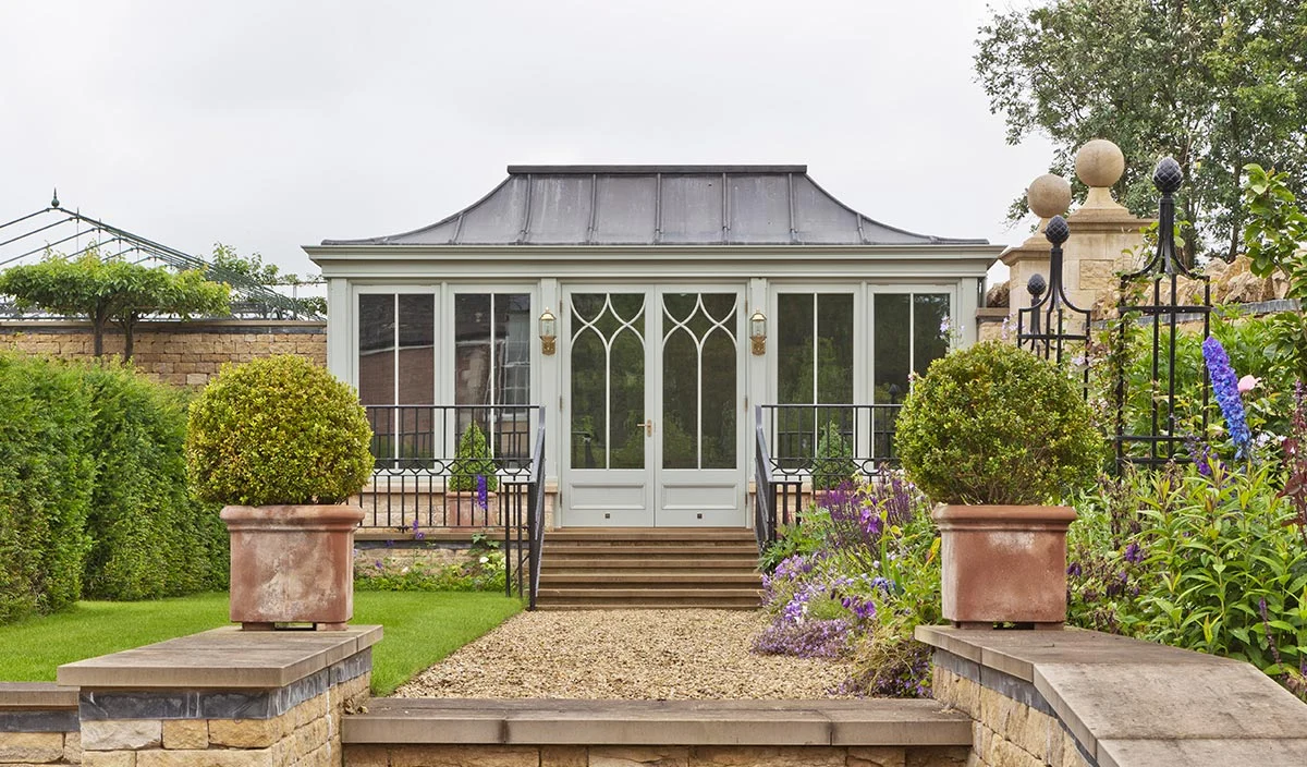 Freestanding conservatory with solid roof