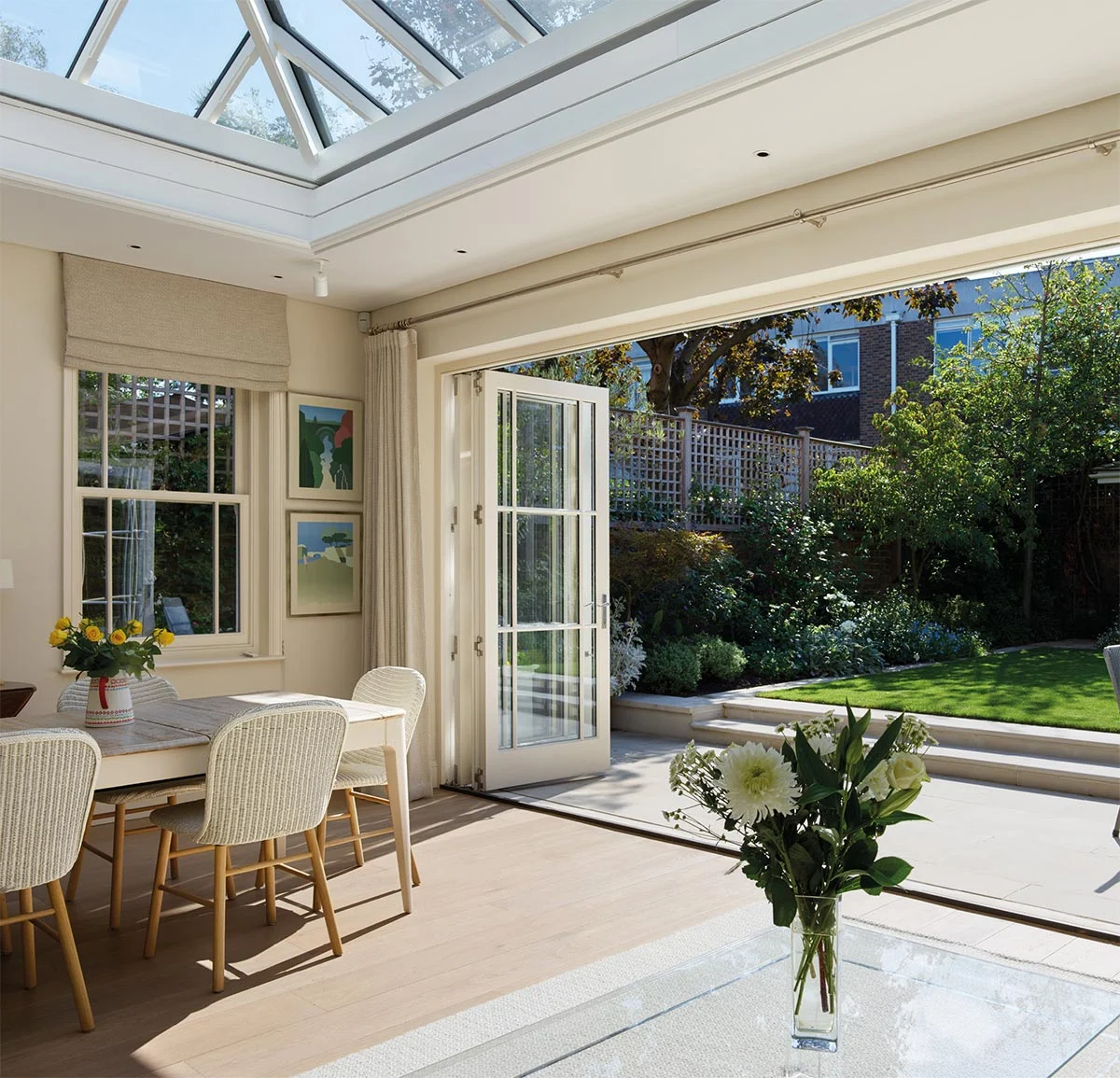 Light filled orangery connected to the garden