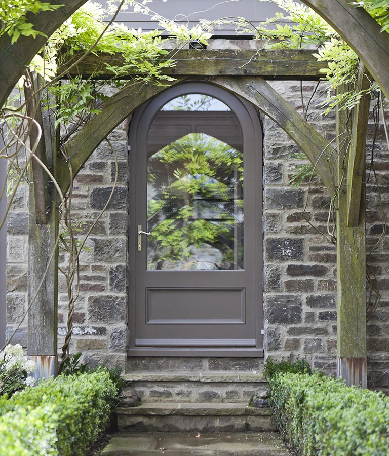 After picture showing the stone arch acting as a doorway for the orangery