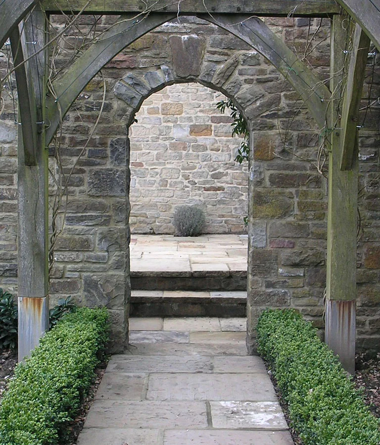 Before picture of stone arch used as an internal orangery door