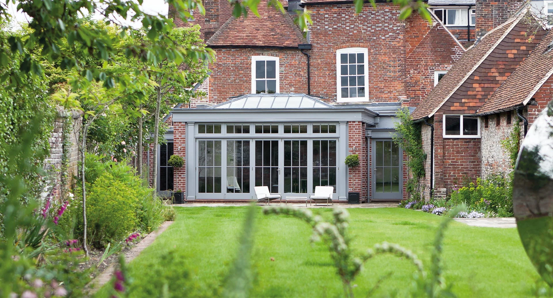 Open plan orangery with folding doors