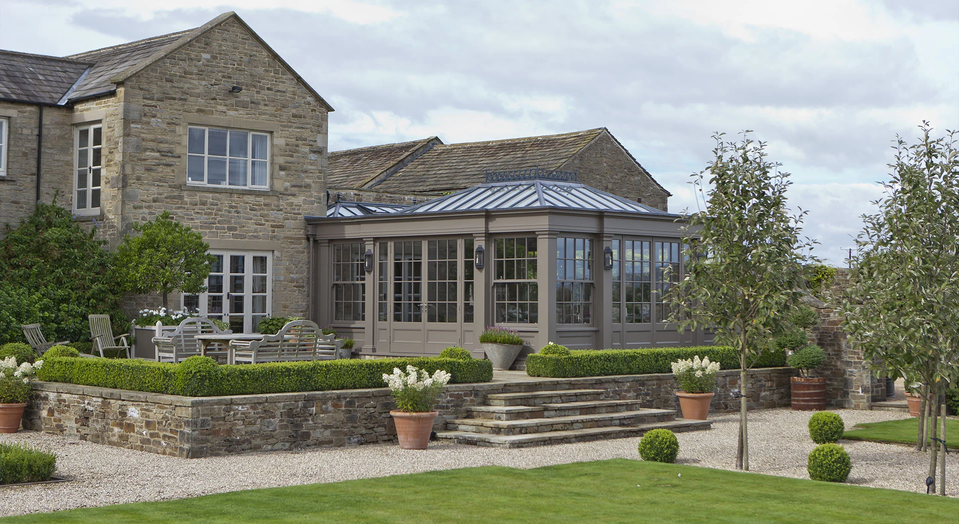 Orangery with formal terrace and seating area