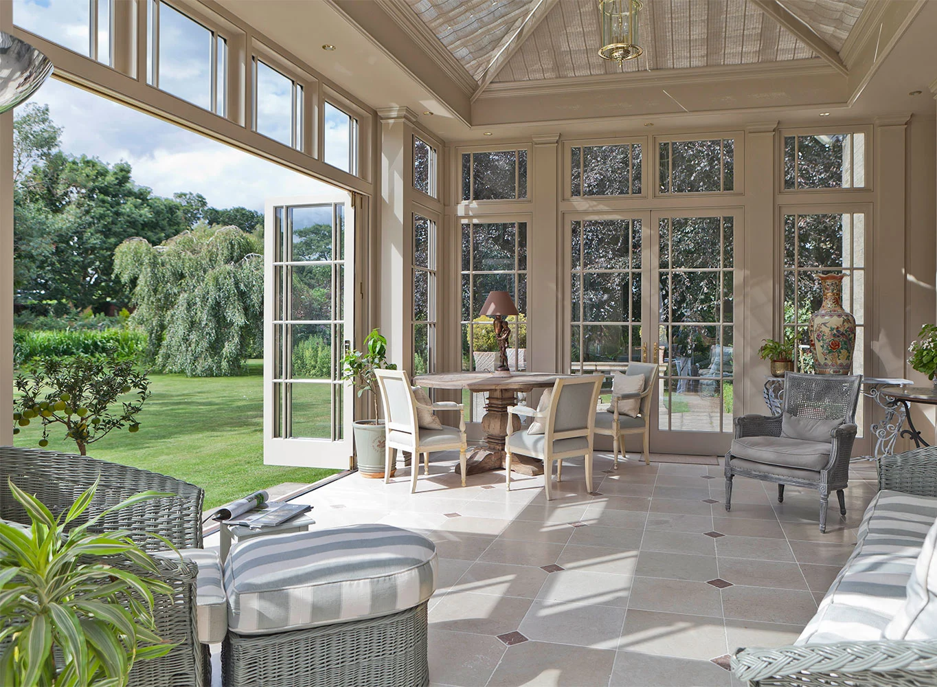 orangery with folding doors open to the garden