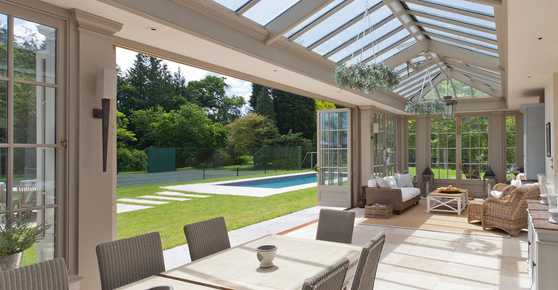 Pool house orangery with folding doors