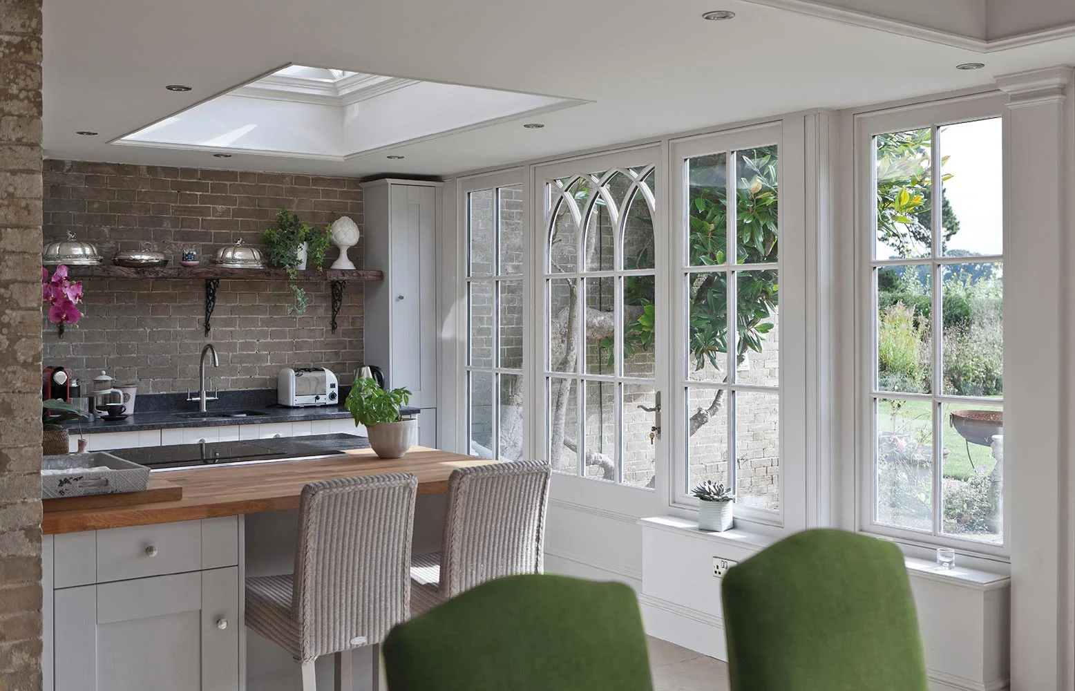 Small kitchen within an orangery extension