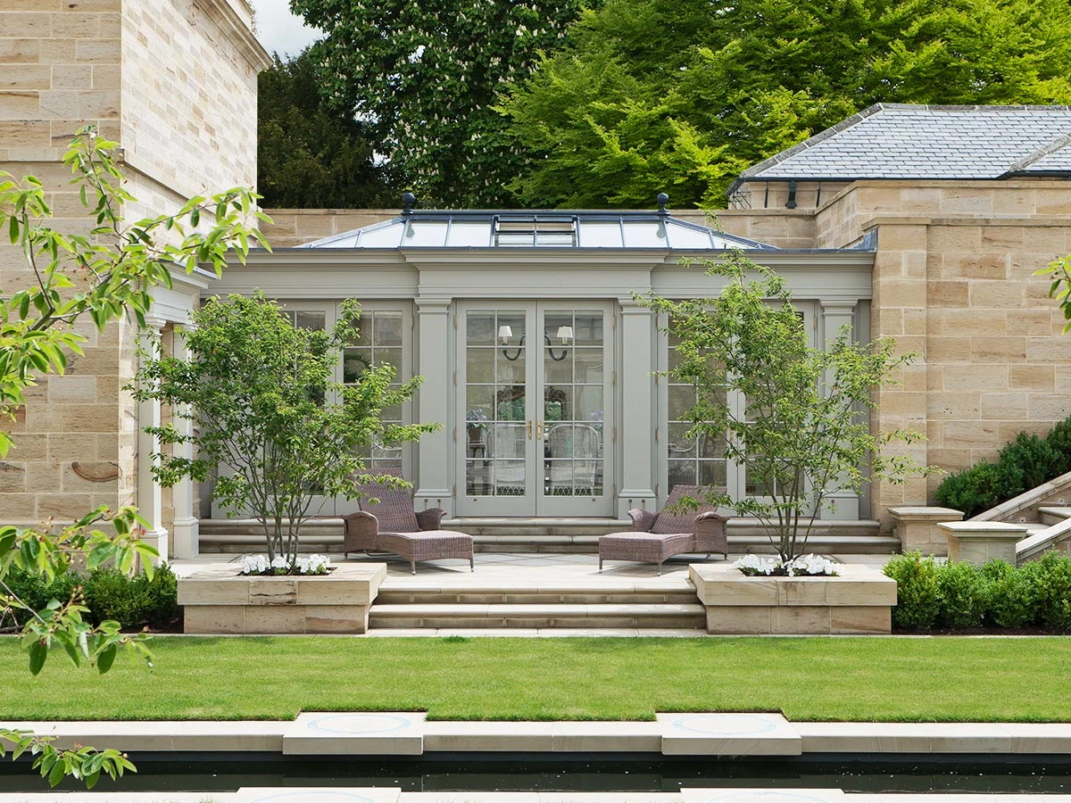 Solid construction linking orangery