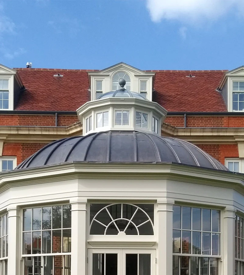 orangery design with a solid lead-topped dome