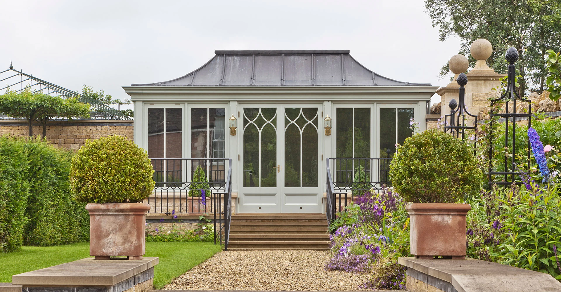 Freestanding conservatory with solid roof