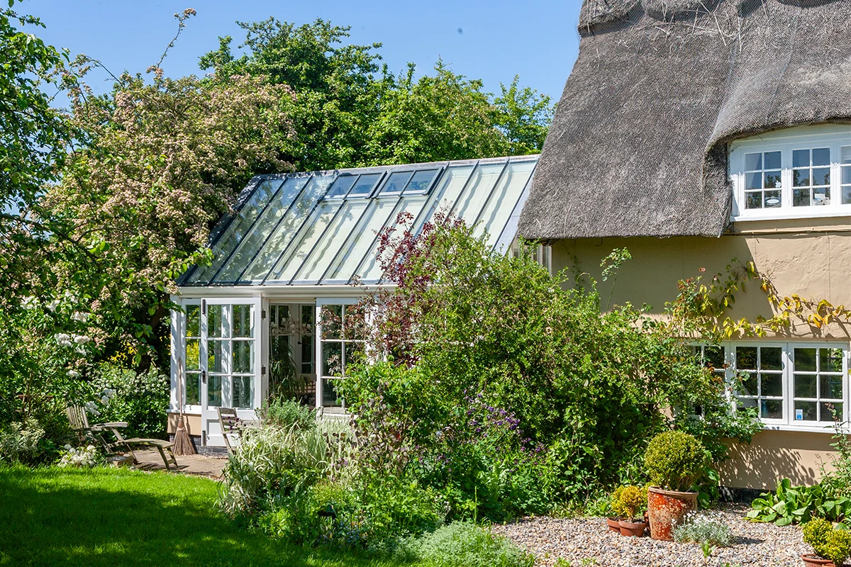Thatched listed cottage with conservatory extension