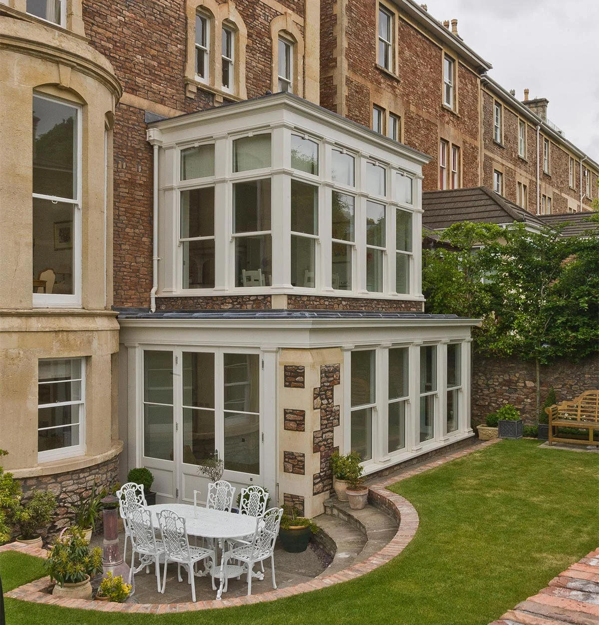 Two storey conservatory leading out to the garden