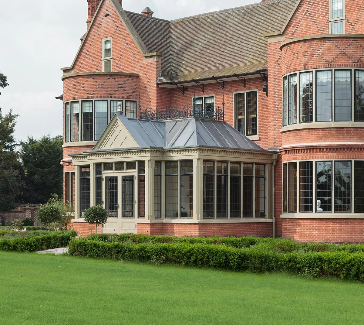 Victorian style conservatory with a solid roof